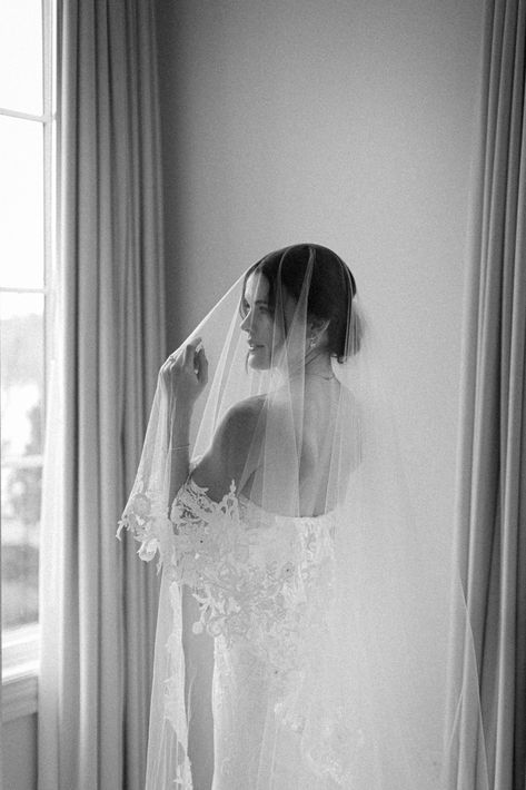 Black and white image of bride in veil